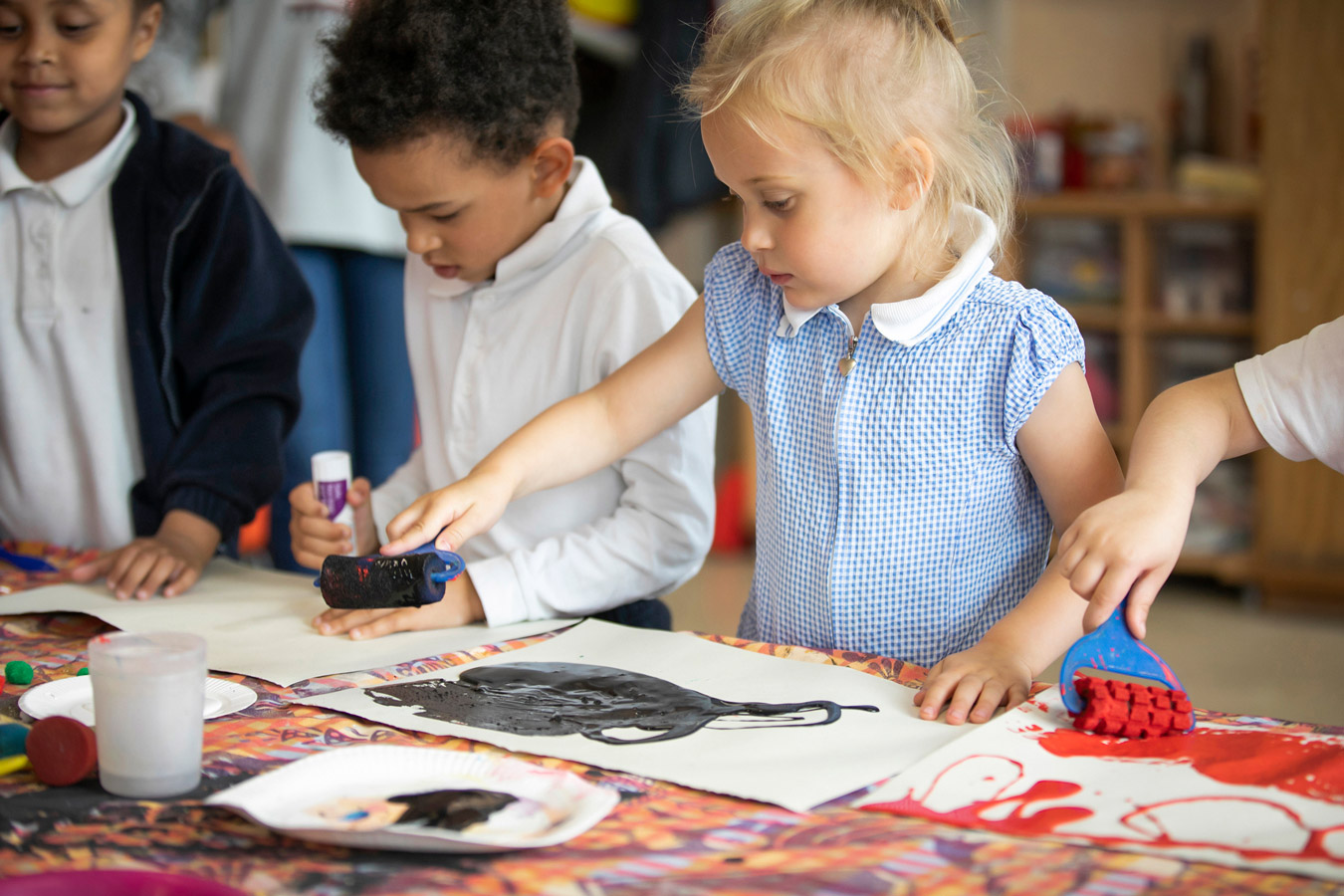 primary school children making art in school