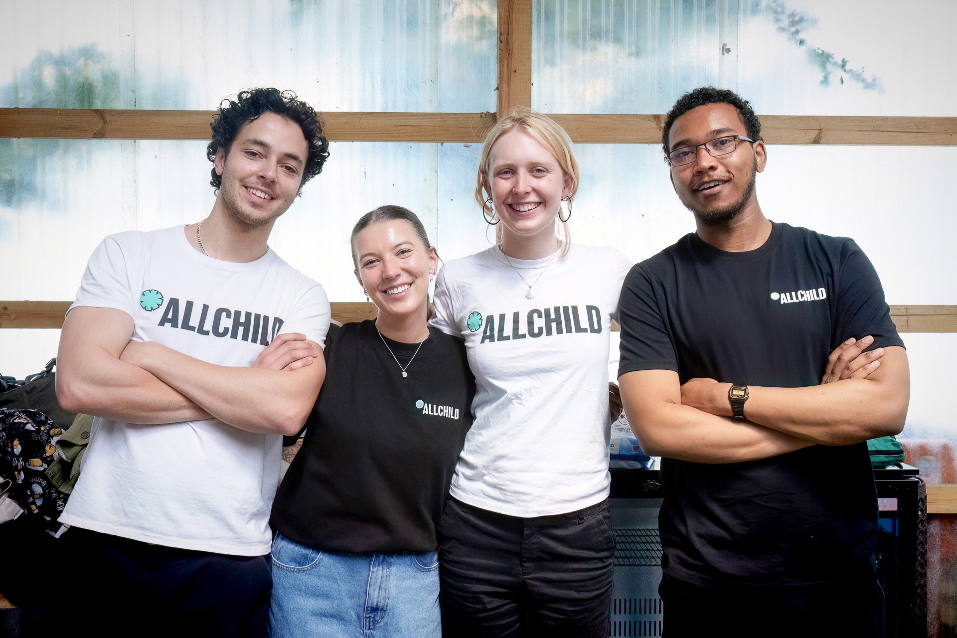 four smiling members of allchild staff
