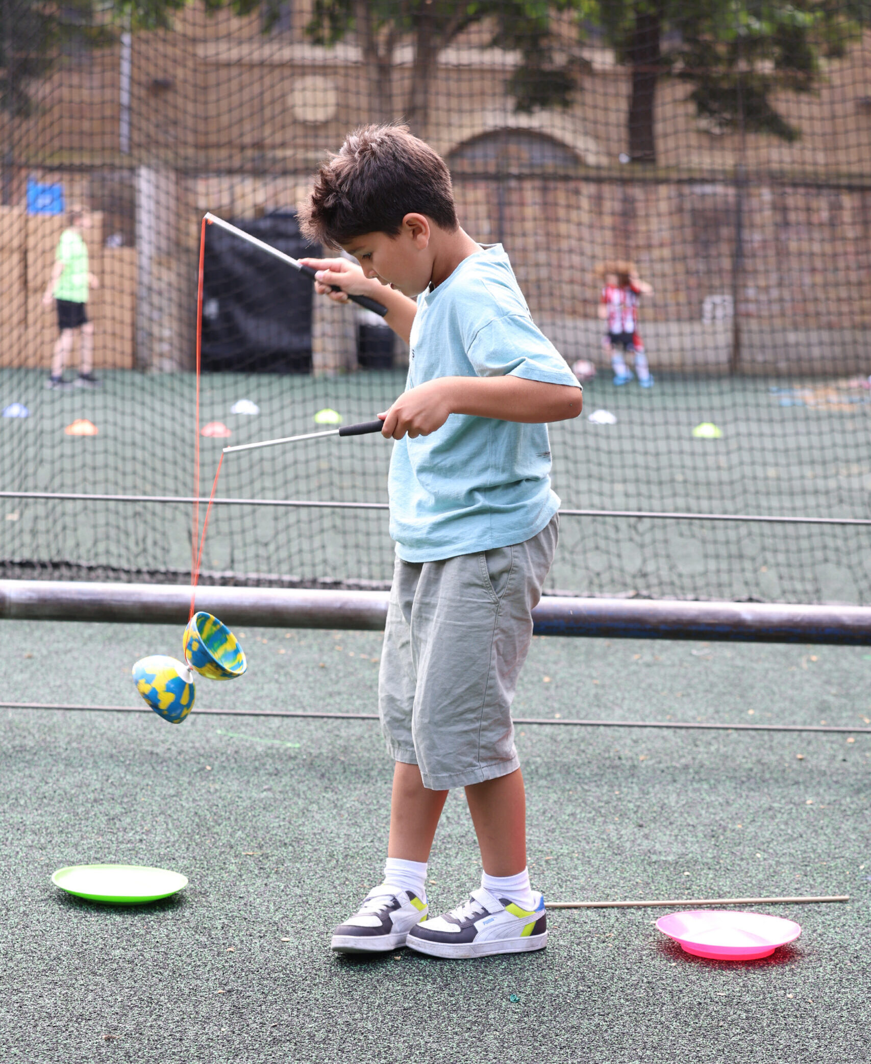 male child playing with toys in playground