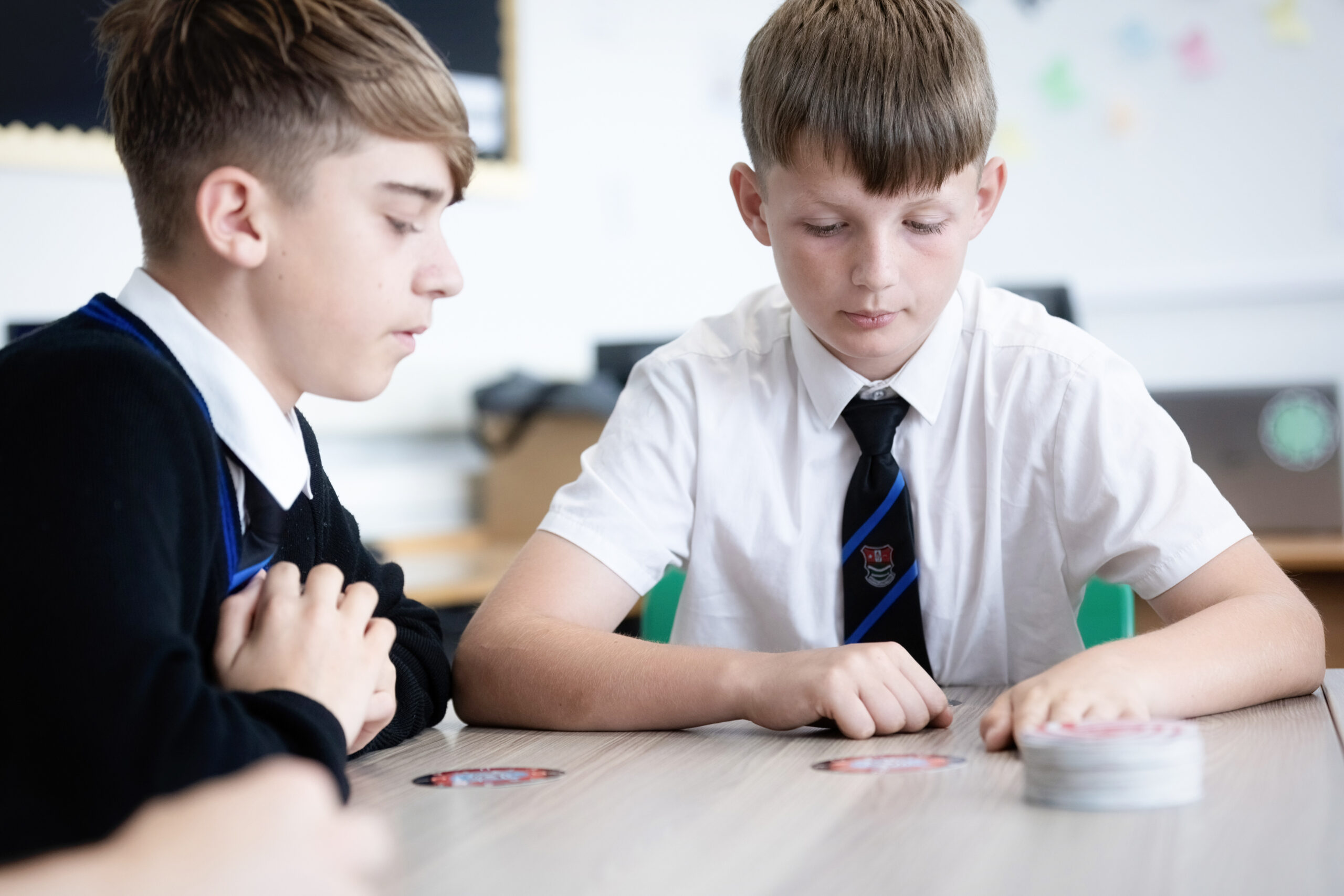 two male children working in class