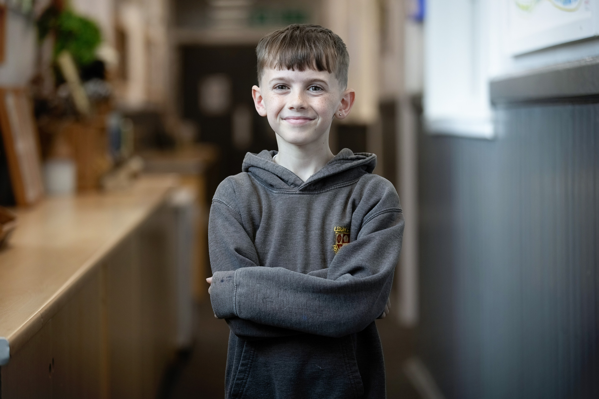 young person in hoodie in school