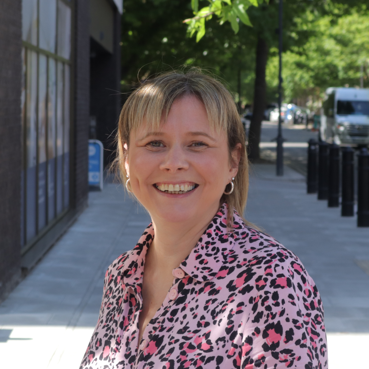 Photo taken outside on the street of Claire Bennett, People and Culture Director at AllChild